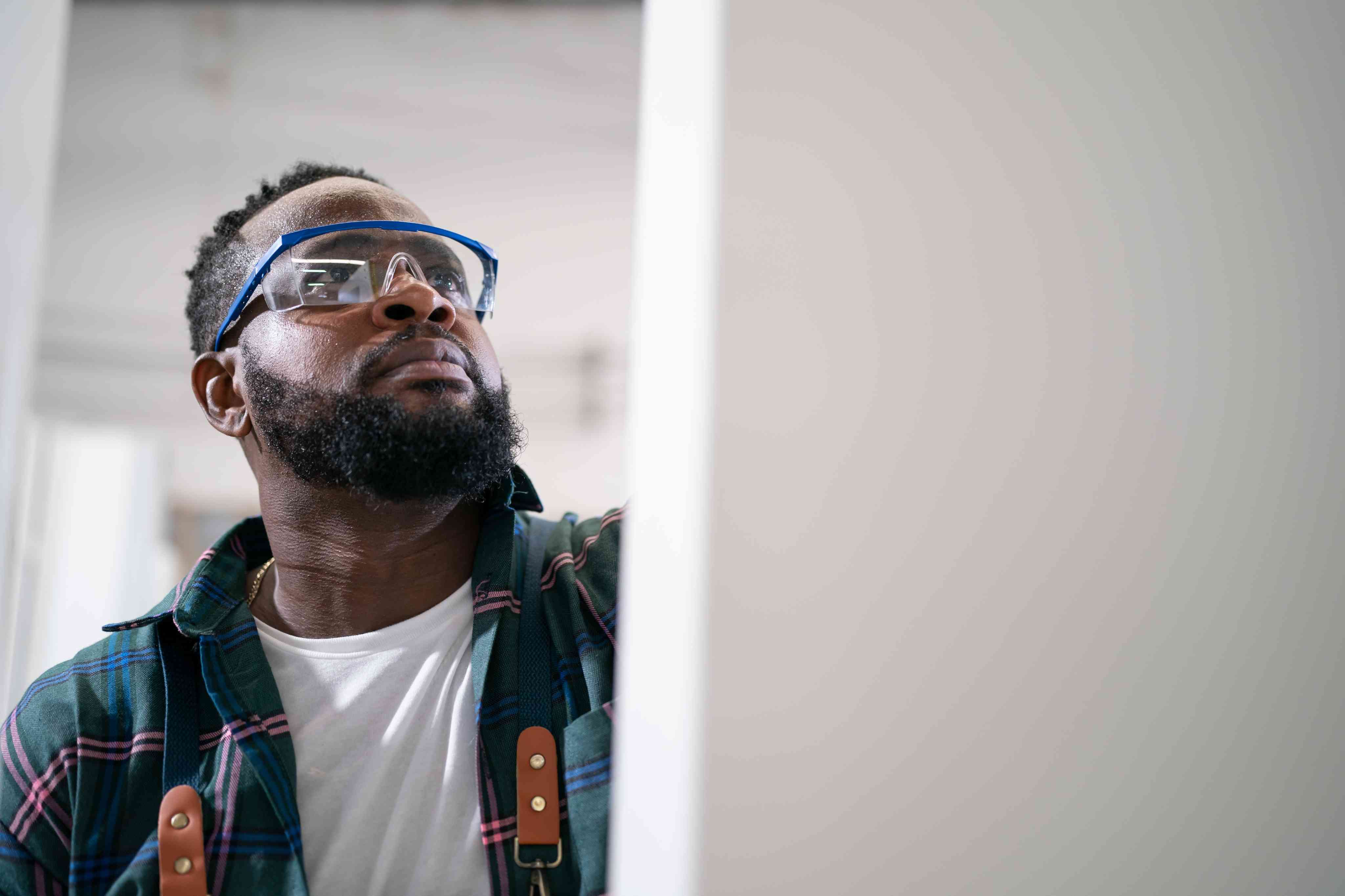 Tyler Davies, builder, looking up while working